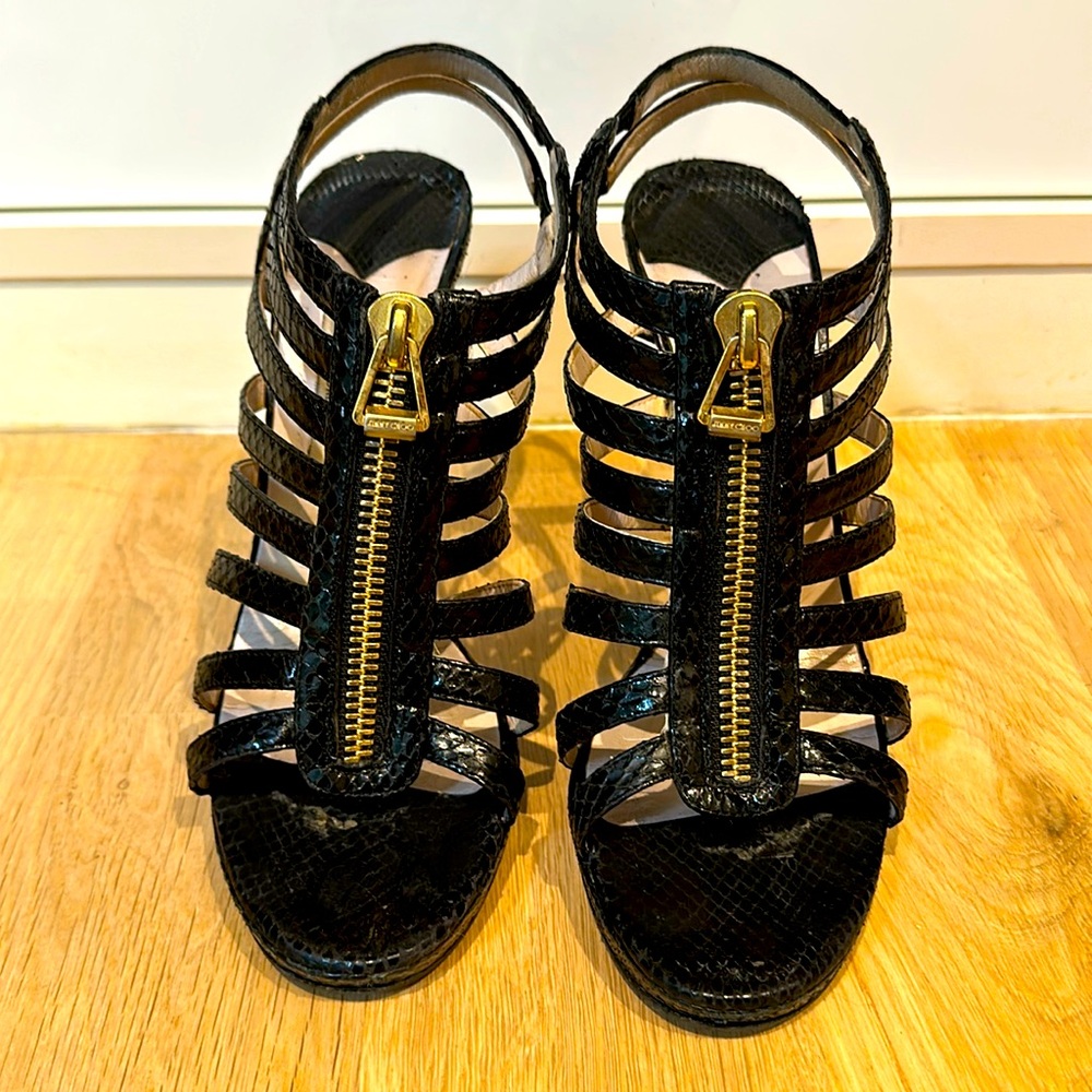 Jimmy Choo black snakeskin zip front platform strappy heels.